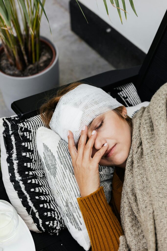 a woman with bandages around her head